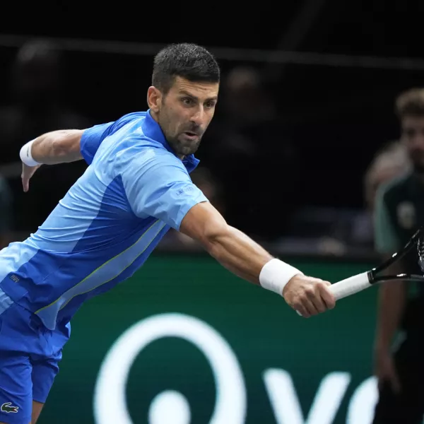 Serbia's Novak Dokovic returns the ball to Denmark's Holger Rune during their quarterfinal match of the Paris Masters tennis tournament, at the Accor Arena in Paris, Friday, Nov. 3, 2023. (AP Photo/Michel Euler)