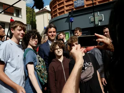 French Prime Minister Gabriel Attal poses for a picture, after Ensemble Pour La Republique candidate and French Government spokesperson Prisca Thevenot and her team were targeted by an unidentified group of youth while they were out putting up campaign posters prior to the second round of the early French parliamentary elections, in Meudon-la-Foret, near Paris, France, July 4, 2024. REUTERS/Benoit Tessier