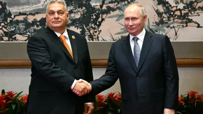 FILE PHOTO: Russian President Vladimir Putin shakes hands with Hungarian Prime Minister Viktor Orban during a meeting ahead of the Belt and Road Forum in Beijing, China, October 17, 2023. Sputnik/Grigory Sysoyev/Pool via REUTERS ATTENTION EDITORS - THIS IMAGE WAS PROVIDED BY A THIRD PARTY./File Photo