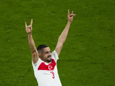 Turkey's Merih Demiral celebrates after scoring his side second goal during a round of sixteen match between Austria and Turkey at the Euro 2024 soccer tournament in Leipzig, Germany, Tuesday, July 2, 2024. UEFA has launched an investigation into Turkey soccer player Merih Demiral's "alleged inappropriate behavior" after he celebrated a goal at Euro 2024 by displaying a hand sign associated with an ultra-nationalist group. (AP Photo/Ebrahim Noroozi)