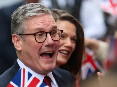 British Prime Minister Keir Starmer and his wife Victoria Starmer react as they greet Labour campaigners and activists at Number 10 Downing Street, following the results of the election, in London, Britain, July 5, 2024. REUTERS/Toby Melville