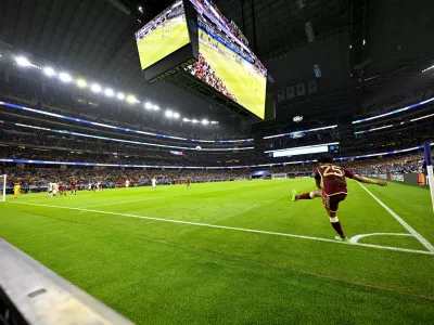 Jul 5, 2024; Arlington, TX, USA; Venezuela forward Eduardo Bello (25) attempts a corner kick against Canada during the second half in the 2024 Copa America quarterfinal at AT&T Stadium. Mandatory Credit: Jerome Miron-USA TODAY Sports