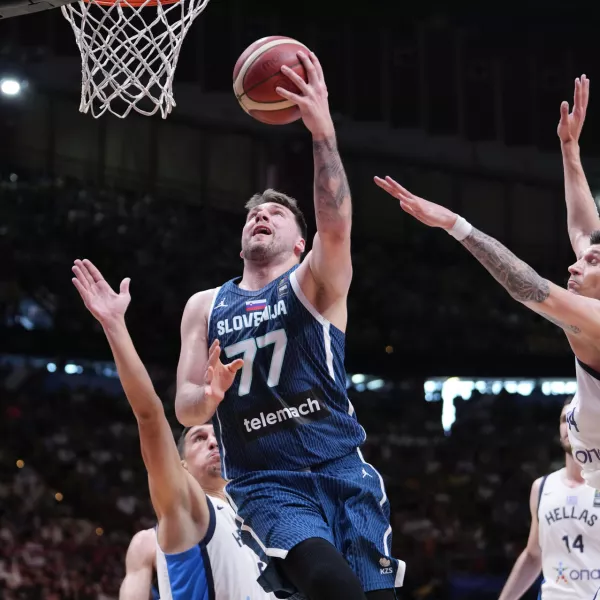 Slovenia's Luka Doncic tries to score against Greece, during an Acropolis tournament basketball match, at the Peace and Friendship indoor stadium at Athens' port city of Piraeus, Saturday, July 6, 2024. (AP Photo/Petros Giannakouris)