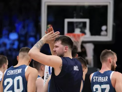 Slovenia's Luka Doncic applauds following an Acropolis tournament basketball match against Greece at the Peace and Friendship indoor stadium at Athens' port city of Piraeus, Greece, Saturday, July 6, 2024. (AP Photo/Petros Giannakouris)