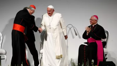 Pope Francis shakes hands with Cardinal Matteo Zuppi on the day of the 50th Social Week of Catholics at the "Generali Convention Center" in Trieste, Italy, July 7, 2024. REUTERS/Alessandro Garofalo