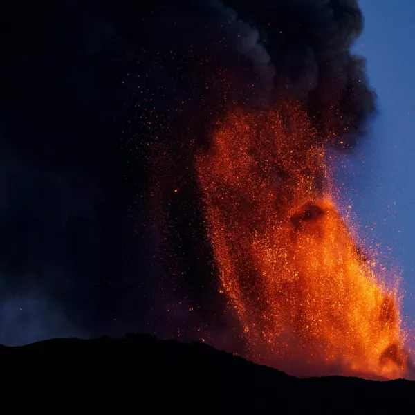 Lava and smoke rise from a crater of Mount Etna, Europe's most active volcano, Italy July 4, 2024. REUTERS/Etna Walk/Giuseppe Di Stefano