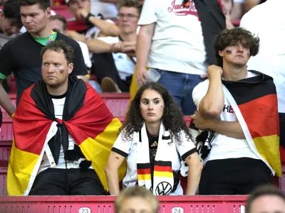 Germany's supporters reacts at the end of a quarter final match between Germany and Spain at the Euro 2024 soccer tournament in Stuttgart, Germany, Friday, July 5, 2024. (AP Photo/Matthias Schrader)