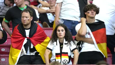 Germany's supporters reacts at the end of a quarter final match between Germany and Spain at the Euro 2024 soccer tournament in Stuttgart, Germany, Friday, July 5, 2024. (AP Photo/Matthias Schrader)