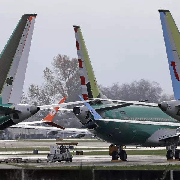 ﻿FILE- In this Nov. 14, 2018, file photo Boeing 737 MAX 8 planes are parked near Boeing Co.'s 737 assembly facility in Renton, Wash. Investigators were rushing to the scene of a devastating plane crash in Ethiopia on Sunday, March 10, 2019, an accident that could renew safety questions about the newest version of Boeing's popular 737 airliner. (AP Photo/Ted S. Warren, File)