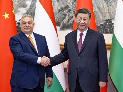 In this photo released by Xinhua News Agency, Hungarian Prime Minister Viktor Orban, left, shakes hands with Chinese President Xi Jinping before a meeting at the Diaoyutai State Guesthouse in Beijing, Monday, July 8, 2024. (Li Xueren/Xinhua via AP)