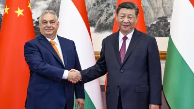 In this photo released by Xinhua News Agency, Hungarian Prime Minister Viktor Orban, left, shakes hands with Chinese President Xi Jinping before a meeting at the Diaoyutai State Guesthouse in Beijing, Monday, July 8, 2024. (Li Xueren/Xinhua via AP)