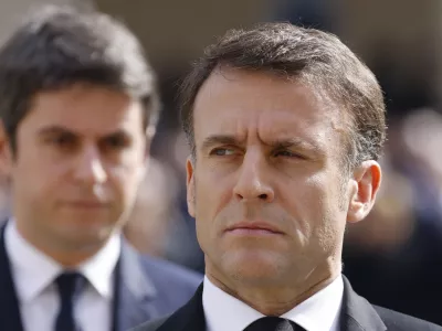 FILE - French Prime Minister Gabriel Attal, left, and French President Emmanuel Macron attend a "national tribute" ceremony to late French politician and admiral, Philippe de Gaulle, son of General de Gaulle, in Paris, Wednesday, March 20, 2024. French President Emmanual Macron refused the resignation Monday July 8, 2024 of the country's prime minister, asking him on Monday to remain temporarily as the head of the government after chaotic election results left the government in limbo. (Ludovic Marin, Pool via AP, File)