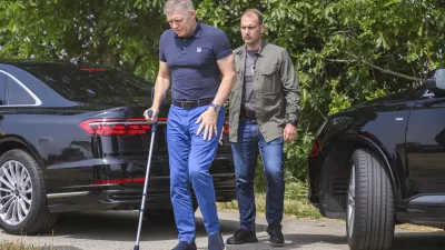 Slovak Prime Minister Robert Fico using a crutch, arrives to attend a press conference during harvest in the village of Slovenska Nova Ves, western Slovakia, Monday, July 8, 2024. Fico is recovering after being seriously wounded in an assassination attempt on May 15. (Jaroslav Novak/TASR via AP)