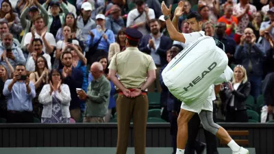 Tennis - Wimbledon - All England Lawn Tennis and Croquet Club, London, Britain - July 8, 2024 Serbia's Novak Djokovic applauds the crowds as he walks off the court after winning his fourth round match against Denmark's Holger Rune REUTERS/Paul Childs