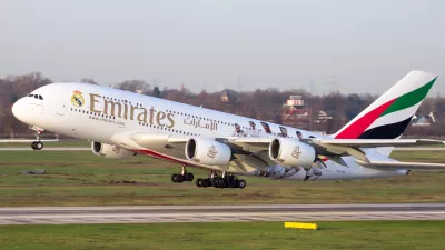 Dusseldorf, Germany - December 17, 2015: Emirates Airbus A380 take off from Dusseldorf airport. Soccer players of Real Madrid are painted on the airplane to show the partnership between Emirates and Real Madrid.