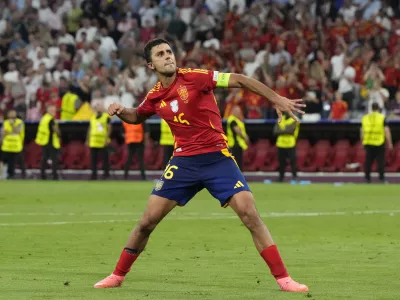 Spain's Rodri celebrates at the end of the semifinal match between Spain and France at the Euro 2024 soccer tournament in Munich, Germany, Tuesday, July 9, 2024. (AP Photo/Hassan Ammar)