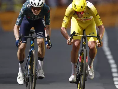 Cycling - Tour de France - Stage 11 - Evaux-les-Bains to Le Lioran - Evaux-les-Bains, France - July 10, 2024 Team Visma | Lease a Bike's Jonas Vingegaard in action before winning stage 11 alongside second place UAE Team Emirates' Tadej Pogacar REUTERS/Stephane Mahe