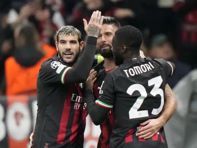 AC Milan's Olivier Giroud, center, celebrates with teammates after scoring his side's third goal during the Champions League, Group E soccer match between AC Milan and FC Salzburg, at the San Siro stadium in Milan, Italy, Wednesday, Nov. 2, 2022. (AP Photo/Luca Bruno)