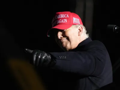 Former President Donald Trump reacts to a supporter during a rally, Thursday, Nov. 3, 2022, in Sioux City, Iowa. (AP Photo/Charlie Neibergall)