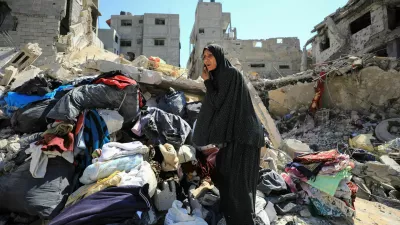 A Palestinian woman inspects the damage, after Israeli forces withdrew from Shejaiya neighborhood, following a ground operation, amid the Israel-Hamas conflict, in the eastern part of Gaza City, July 10, 2024. REUTERS/Dawoud Abu Alkas   TPX IMAGES OF THE DAY