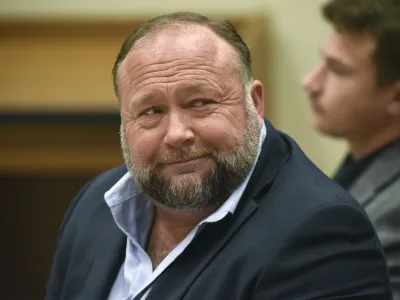 FILE - Infowars founder Alex Jones appears in court to testify during the Sandy Hook defamation damages trial at Connecticut Superior Court in Waterbury, Conn., on Thursday, Sept. 22, 2022. Jones and his company have been ordered to pay an extra 3 million to families and an FBI agent for calling the 2012 Sandy Hook school shooting a hoax. (Tyler Sizemore/Hearst Connecticut Media via AP, Pool, File)