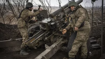 FILE - Ukrainian soldiers of the 71st Jaeger Brigade fire a M101 howitzer towards Russian positions at the frontline, near Avdiivka, Donetsk region, Ukraine, Friday, March 22, 2024. Much of what NATO can do for Ukraine, and indeed for global security, is misunderstood. Often in the public mind, the alliance is thought of as the sum of all U.S. relations with its European partners, from imposing sanctions and other costs on Russia to sending arms and ammunition. But as an organization its brief is limited to the defense by military means of its 32 member countries and a commitment to help keep the peace in Europe and North America. (AP Photo/Efrem Lukatsky, File)