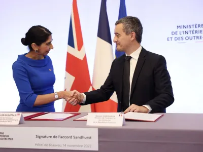 French Interior Minister Gerald Darmanin and Britain's Home Secretary Suella Braverman sign a joint declaration signature at the Hotel Beauvau Interior Ministry in Paris, France November 14, 2022. Thomas Samson/Pool via REUTERS