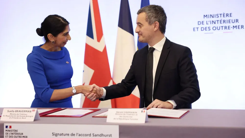 French Interior Minister Gerald Darmanin and Britain's Home Secretary Suella Braverman sign a joint declaration signature at the Hotel Beauvau Interior Ministry in Paris, France November 14, 2022. Thomas Samson/Pool via REUTERS