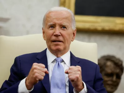 U.S. President Joe Biden gestures as he hosts a bilateral meeting with Britain's new Prime Minister Keir Starmer, on the sidelines of NATO's 75th anniversary summit, in the Oval Office at the White House in Washington, U.S. July 10, 2024. REUTERS/Evelyn Hockstein   TPX IMAGES OF THE DAY