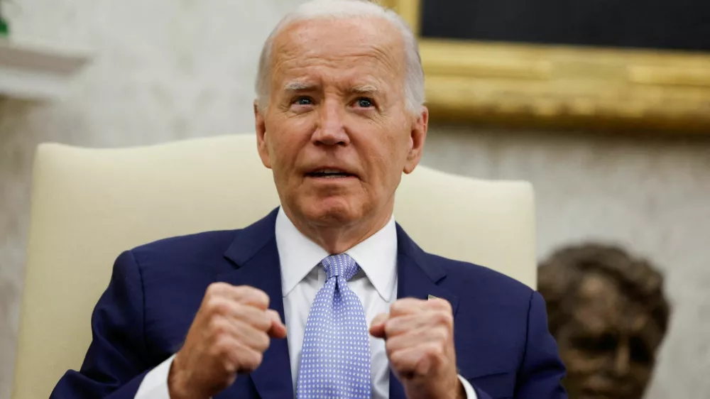 U.S. President Joe Biden gestures as he hosts a bilateral meeting with Britain's new Prime Minister Keir Starmer, on the sidelines of NATO's 75th anniversary summit, in the Oval Office at the White House in Washington, U.S. July 10, 2024. REUTERS/Evelyn Hockstein   TPX IMAGES OF THE DAY