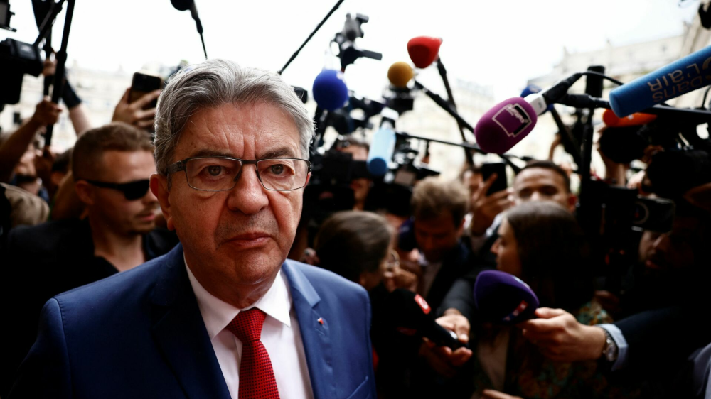 Jean-Luc Melenchon, leader of French far-left opposition party La France Insoumise (France Unbowed - LFI), talks to journalists in front of the National Assembly in Paris after the second round of the early French parliamentary elections, France, July 9, 2024. REUTERS/Yara Nardi