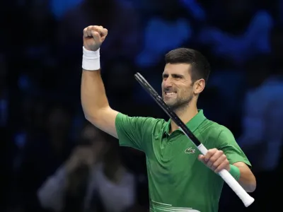 Serbia's Novak Djokovic celebrates after winning against Greece's Stefanos Tsitsipas during their singles tennis match of the ATP World Tour Finals, at the Pala Alpitour in Turin, Italy, Monday, Nov. 14, 2022. (AP Photo/Antonio Calanni)