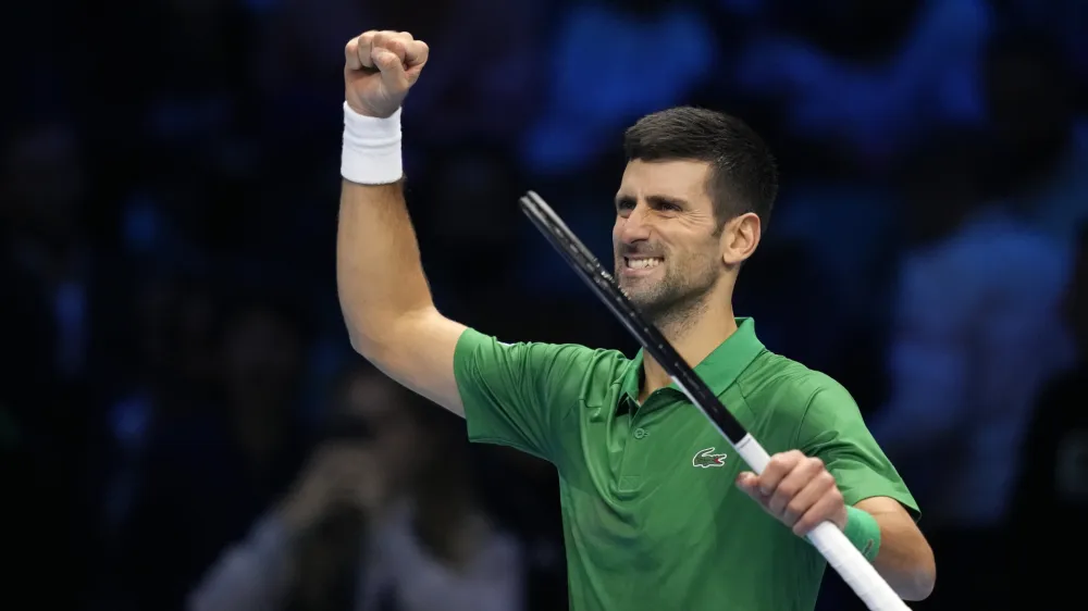 Serbia's Novak Djokovic celebrates after winning against Greece's Stefanos Tsitsipas during their singles tennis match of the ATP World Tour Finals, at the Pala Alpitour in Turin, Italy, Monday, Nov. 14, 2022. (AP Photo/Antonio Calanni)