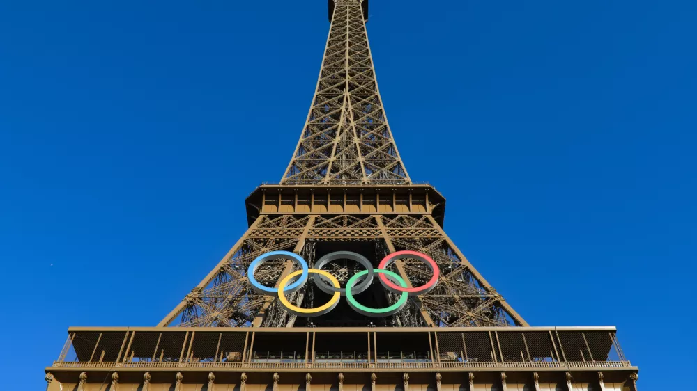 10 July 2024, France, Paris: The Eiffel Tower harbors the OLYMPIC RINGS for the Paris 2024 Olympic Games. Photo: Mickael Chavet/ZUMA Press Wire/dpa