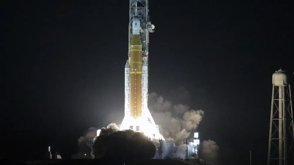 NASA's new moon rocket lifts off from Launch Pad 39B at the Kennedy Space Center in Cape Canaveral, Fla., Wednesday, Nov. 16, 2022. This launch is the first flight test of the Artemis program. (AP Photo/John Raoux)