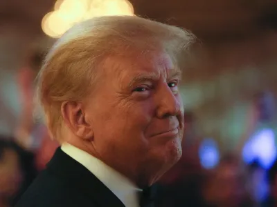 Former President Donald Trump smiles toward guests, as he arrives to speak at an event at Mar-a-Lago, Friday, Nov. 18, 2022, in Palm Beach, Fla. Earlier in the day Attorney General Merrick Garland named a special counsel to oversee the Justice Department's investigation into the presence of classified documents at Trump's Florida estate and aspects of a separate probe involving the Jan. 6, 2021, insurrection and efforts to undo the 2020 election. (AP Photo/Rebecca Blackwell)