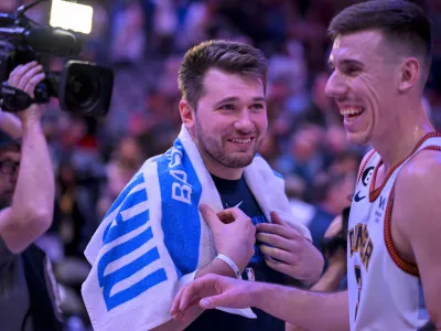 Nov 18, 2022; Dallas, Texas, USA; Dallas Mavericks guard Luka Doncic (left) talks with Denver Nuggets forward Vlatko Cancar (right) after the game at the American Airlines Center. Mandatory Credit: Jerome Miron-USA TODAY Sports