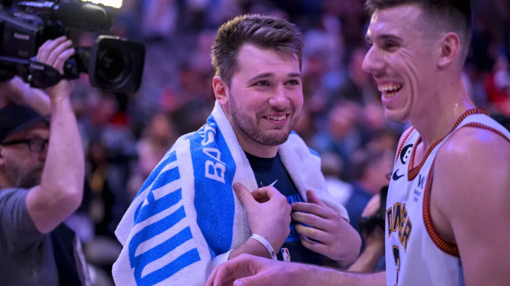 Nov 18, 2022; Dallas, Texas, USA; Dallas Mavericks guard Luka Doncic (left) talks with Denver Nuggets forward Vlatko Cancar (right) after the game at the American Airlines Center. Mandatory Credit: Jerome Miron-USA TODAY Sports