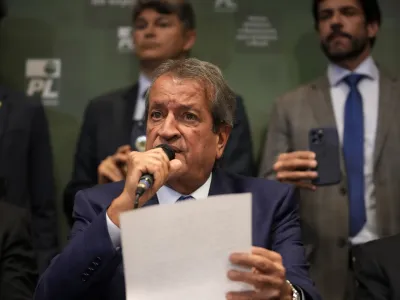 Valdemar Costa Neto, the leader of President Jair Bolsonaro's Liberal Party, center, speaks during a press conference regarding an investigation carried out by the party pointing out inconsistencies in voting machines used in the general elections, in Brasilia, Brazil, Tuesday, Nov. 22, 2022. Bolsonaro is contesting his defeat in the October election and calling on the electoral authority to annul votes cast on more than half of electronic voting machines used. (AP Photo/Eraldo Peres)