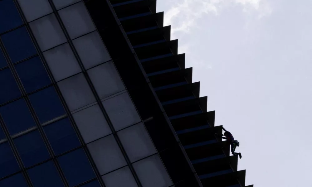 Urban climber Alain Robert, also known as the "French Spiderman" climbs the G.T. International Tower in Makati, Metro Manila, Philippines, March 5, 2024. REUTERS/Eloisa Lopez   TPX IMAGES OF THE DAY