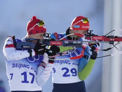 ﻿Jakub Stvrtecky of the Czech Republics (17) and Jakov Fak of Slovenia shoot during the men's 20-kilometer individual race at the 2022 Winter Olympics, Tuesday, Feb. 8, 2022, in Zhangjiakou, China. (AP Photo/Kirsty Wigglesworth)