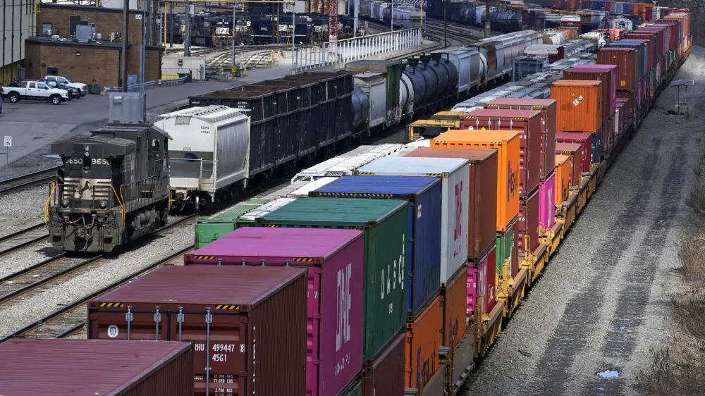 FILE - Freight train cars and containers at Norfolk Southern Railroad's Conway Yard in Conway, Pa., April 2, 2021. President Joe Biden's call for Congress to intervene in the railroad contract dispute undercuts the unions' efforts to address workers' quality of life concerns, but businesses stress that it is crucial to avoid a strike that would devastate the economy. (AP Photo/Gene J. Puskar, File)