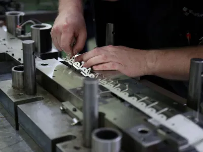 FILE PHOTO: A worker at contract precision stamping company Brandauer's factory in Birmingham, Britain, July 28, 2022. REUTERS/Molly Darlington/File Photo