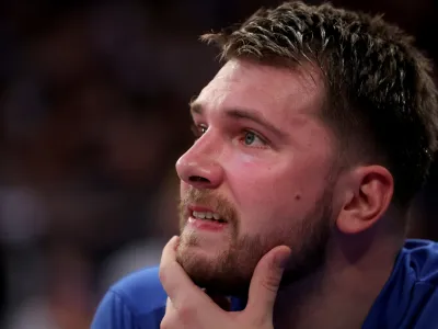 Dec 3, 2022; New York, New York, USA; Dallas Mavericks guard Luka Doncic (77) watches from the bench during the second quarter against the New York Knicks at Madison Square Garden. Mandatory Credit: Brad Penner-USA TODAY Sports