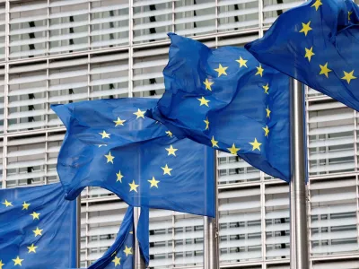 FILE PHOTO: European Union flags flutter outside the EU Commission headquarters in Brussels, Belgium, September 28, 2022. REUTERS/Yves Herman//File Photo