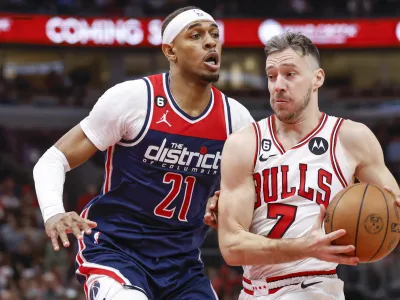 Dec 7, 2022; Chicago, Illinois, USA; Chicago Bulls guard Goran Dragic (7) drives to the basket against Washington Wizards center Daniel Gafford (21) during the second half at United Center. Mandatory Credit: Kamil Krzaczynski-USA TODAY Sports