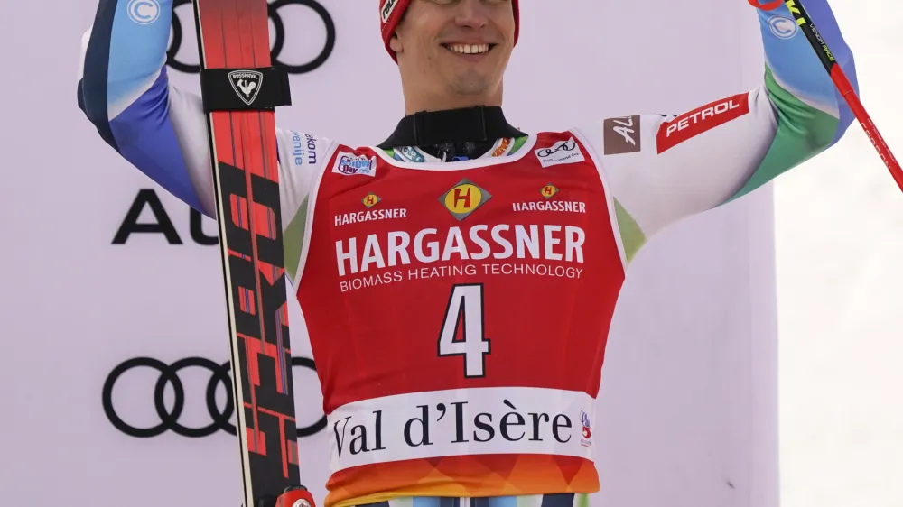 Slovenia's Zan Kranjec celebrates taking third place in an alpine ski, men's World Cup giant slalom, in Val D'Isere, France, Saturday, Dec.10, 2022. (AP Photo/Giovanni Auletta)