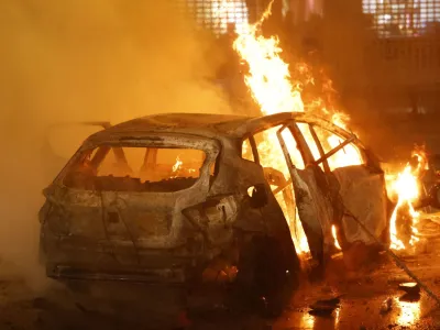 Clashes in Brussels after the World Cup football match between Belgium and Morocco - Brussels, Belgium - November 27, 2022 General view of a car on fire during clashes after the World Cup match between Belgium and Morocco REUTERS/Yves Herman