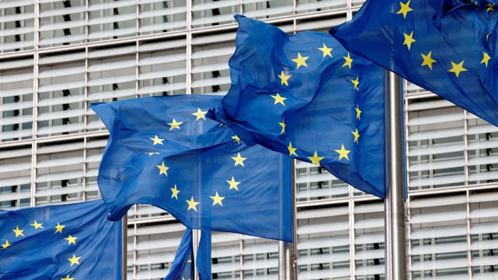 FILE PHOTO: European Union flags flutter outside the EU Commission headquarters in Brussels, Belgium, September 28, 2022. REUTERS/Yves Herman/File Photo