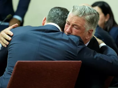 US actor Alec Baldwin hugs his attorney Alex Spiro at the conclusion of Baldwin's trial on involuntary manslaughter at Santa Fe County District Court in Santa Fe, New Mexico, on July 12, 2024. Baldwin's trial for involuntary manslaughter was dismissed by a judge Friday after she ruled that key evidence over a fatal shooting on the set of "Rust" had been withheld from the defense.   RAMSAY DE GIVE/Pool via REUTERS